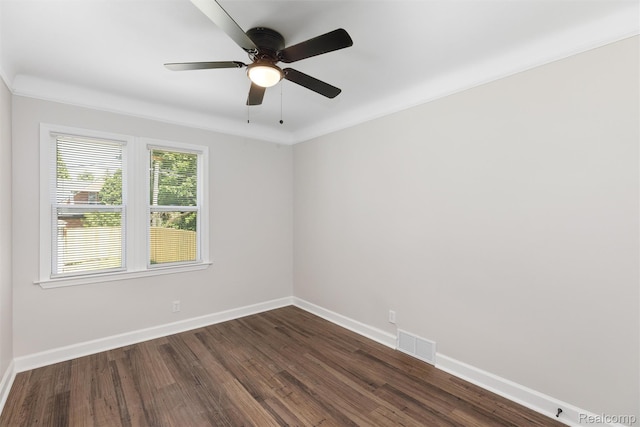 7505 E Robinwood St, Detroit, MI 48234 - unfurnished room featuring baseboards, dark wood finished floors, a ceiling fan, and crown molding