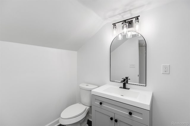 7505 E Robinwood St, Detroit, MI 48234 - bathroom with vaulted ceiling, vanity, toilet, and baseboards