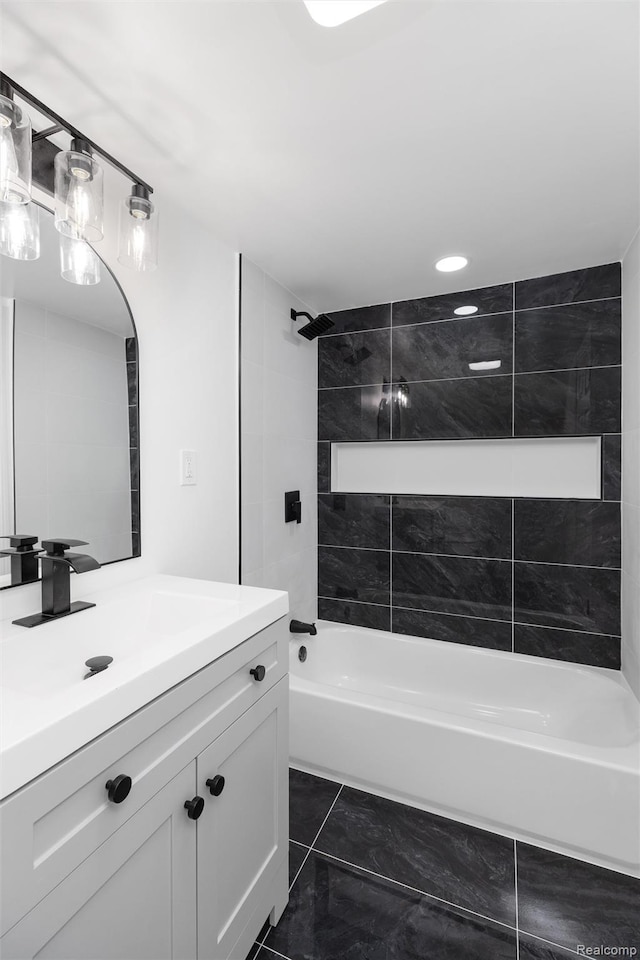 7505 E Robinwood St, Detroit, MI 48234 - bathroom featuring vanity, bathtub / shower combination, marble look tiles, and recessed lighting