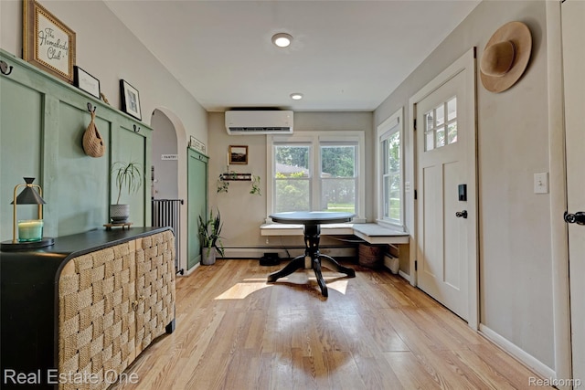 110 Minnetonka Dr, Oxford, MI 48371 - entrance foyer featuring a wall mounted air conditioner, light wood-type flooring, arched walkways, baseboards, and recessed lighting