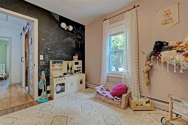 110 Minnetonka Dr, Oxford, MI 48371 - playroom featuring a baseboard heating unit, wood finished floors, and wallpapered walls