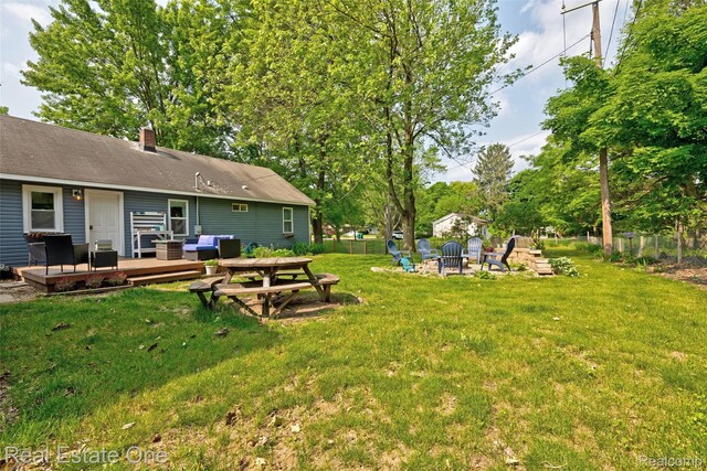 110 Minnetonka Dr, Oxford, MI 48371 - view of yard with an outdoor fire pit and a wooden deck
