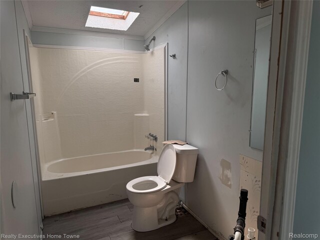 59227 Lewis Ln, New Haven, MI 48048 - full bath featuring a skylight, wood finished floors, shower / tub combination, and ornamental molding