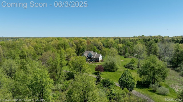 1355 Maxfield Rd, Brighton, MI 48114 - aerial view of property and surrounding area featuring a forest