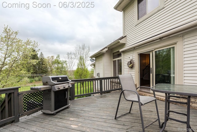 1355 Maxfield Rd, Brighton, MI 48114 - wooden deck with a grill