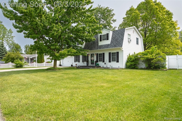 527 Montana St, Marysville, MI 48040 - view of front of property featuring a garage, a shingled roof, and a gambrel roof