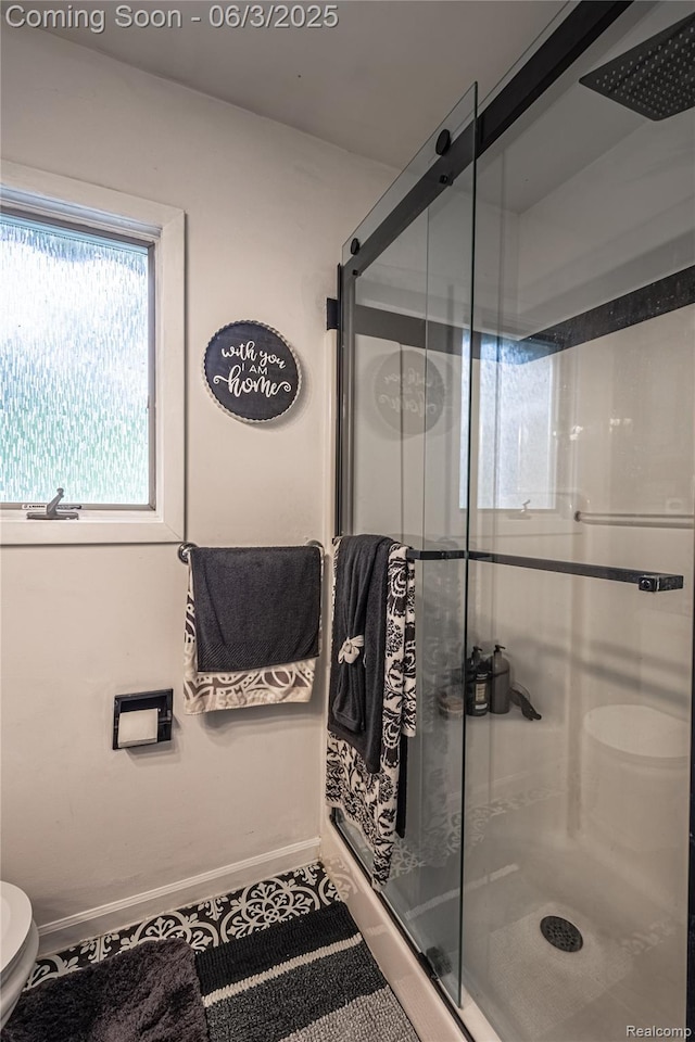 527 Montana St, Marysville, MI 48040 - bathroom with toilet, a shower stall, and baseboards