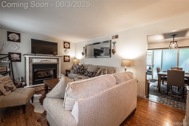 527 Montana St, Marysville, MI 48040 - living area with wood finished floors and a tiled fireplace