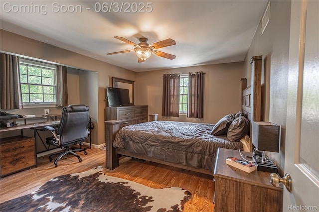 527 Montana St, Marysville, MI 48040 - bedroom with wood finished floors, a desk, and a ceiling fan
