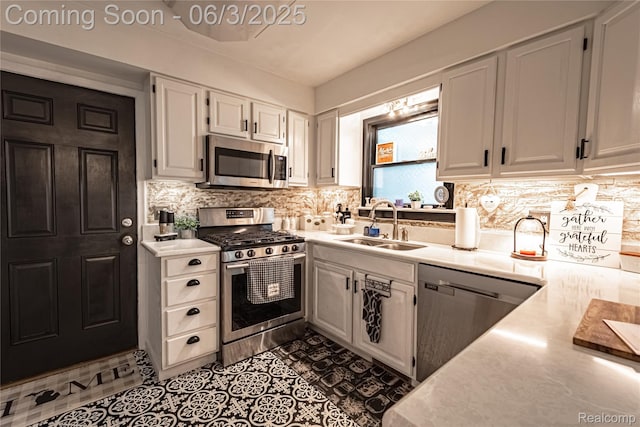 527 Montana St, Marysville, MI 48040 - kitchen featuring appliances with stainless steel finishes, a sink, light countertops, and tasteful backsplash
