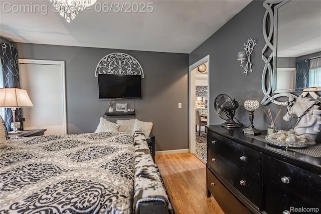 527 Montana St, Marysville, MI 48040 - bedroom featuring light wood-style floors and a chandelier