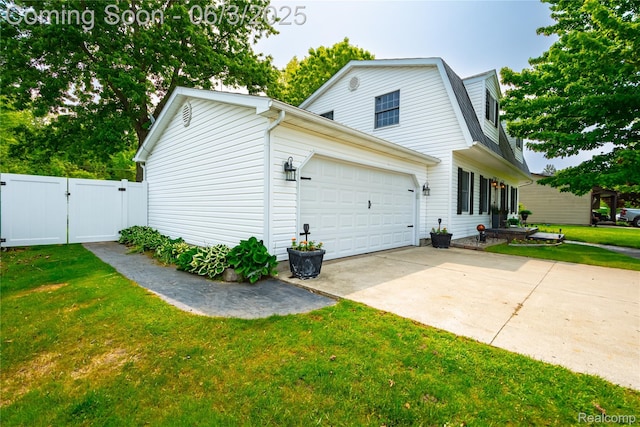 527 Montana St, Marysville, MI 48040 - view of home's exterior with a gate, a gambrel roof, driveway, and a garage