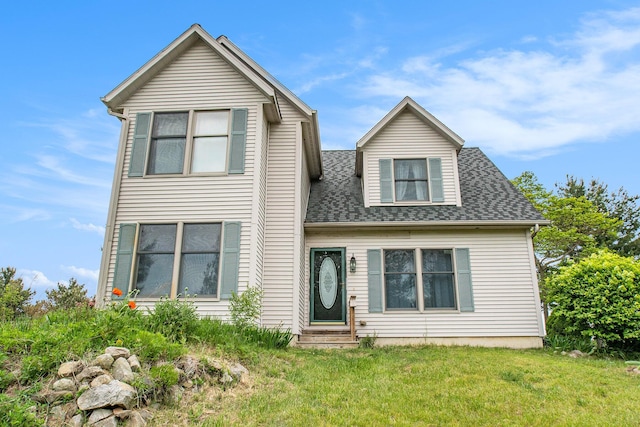 2278 W Wagner Rd, Buchanan, MI 49107 - view of front of property featuring entry steps, a front lawn, and a shingled roof
