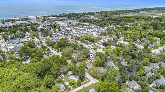 121 S Barker St, New Buffalo, MI 49117 - aerial overview of property's location with a large body of water and nearby suburban area