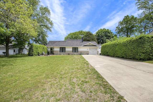 121 S Barker St, New Buffalo, MI 49117 - view of front of house with concrete driveway, a front lawn, an attached garage, and stone siding