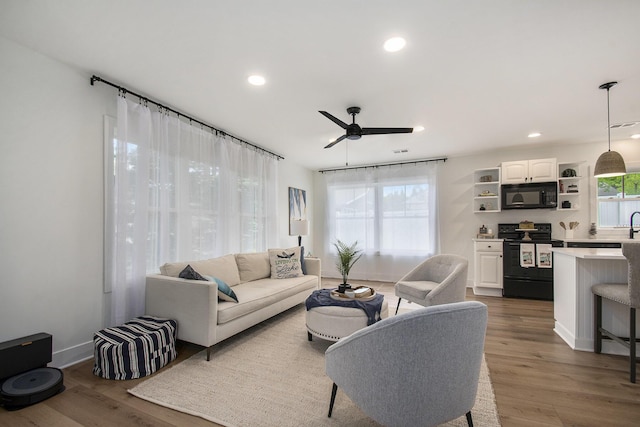 121 S Barker St, New Buffalo, MI 49117 - living room featuring ceiling fan, recessed lighting, wood finished floors, and baseboards