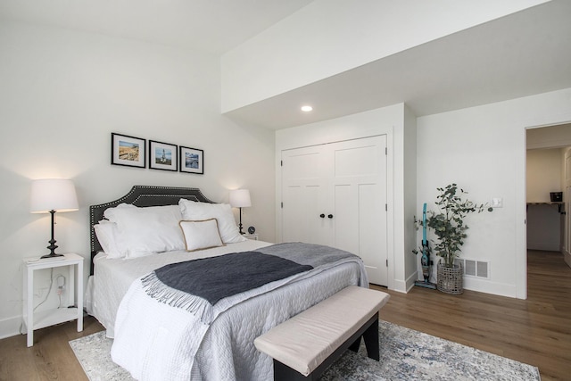 121 S Barker St, New Buffalo, MI 49117 - bedroom with wood finished floors, baseboards, a closet, and recessed lighting
