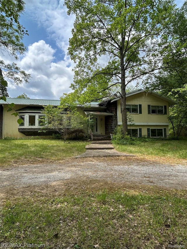 2625 Preston Ln, Howell, MI 48855 - tri-level home featuring driveway and a metal roof
