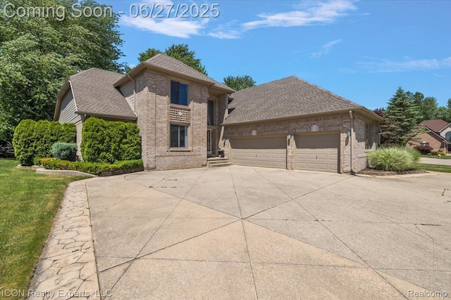 18529 Sumpter Forest Dr, Macomb, MI 48042 - view of front of home with brick siding, driveway, an attached garage, and a shingled roof