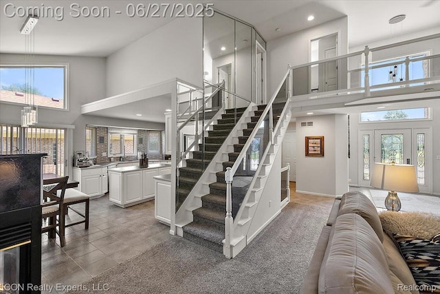 18529 Sumpter Forest Dr, Macomb, MI 48042 - stairs with a towering ceiling, recessed lighting, and tile patterned floors