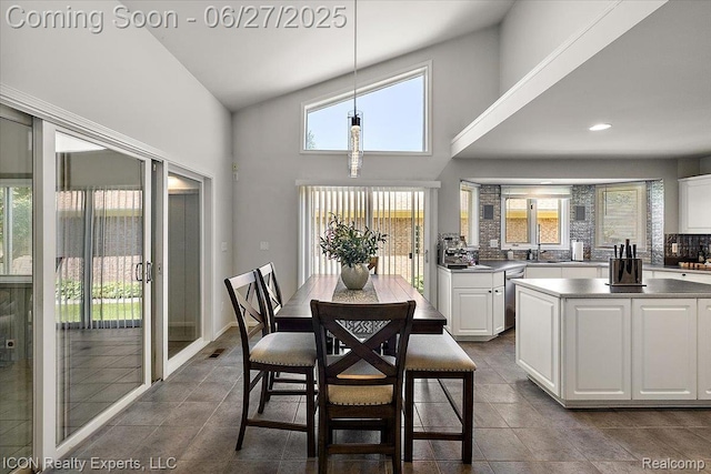 18529 Sumpter Forest Dr, Macomb, MI 48042 - dining space with healthy amount of natural light, high vaulted ceiling, recessed lighting, and dark tile patterned floors