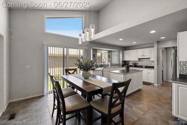 18529 Sumpter Forest Dr, Macomb, MI 48042 - dining area featuring healthy amount of natural light, a towering ceiling, and recessed lighting