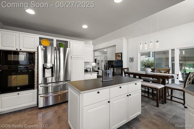 18529 Sumpter Forest Dr, Macomb, MI 48042 - kitchen with black appliances, a kitchen island, white cabinets, and recessed lighting