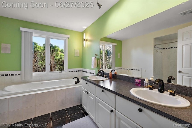 18529 Sumpter Forest Dr, Macomb, MI 48042 - full bath with tile patterned flooring, double vanity, a garden tub, and a tile shower