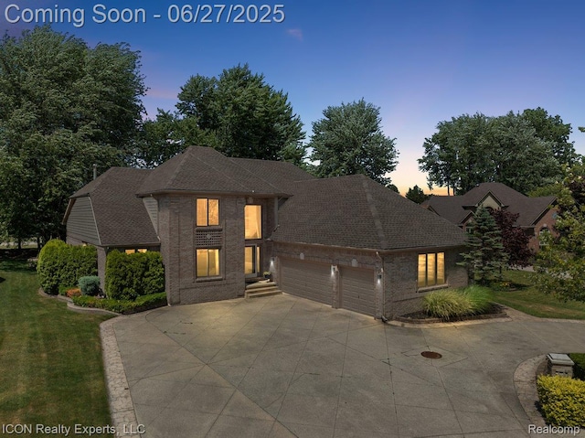 18529 Sumpter Forest Dr, Macomb, MI 48042 - view of front of property with an attached garage, driveway, brick siding, roof with shingles, and a front yard
