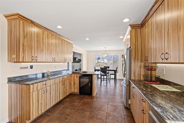 254 Cross Timbers St, Oxford, MI 48371 - kitchen with beverage cooler, a peninsula, recessed lighting, dark tile patterned flooring, and dark stone counters