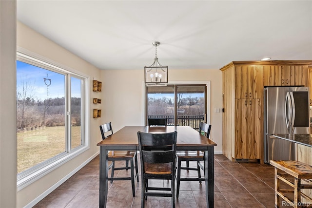 254 Cross Timbers St, Oxford, MI 48371 - dining room with a chandelier and dark tile patterned floors