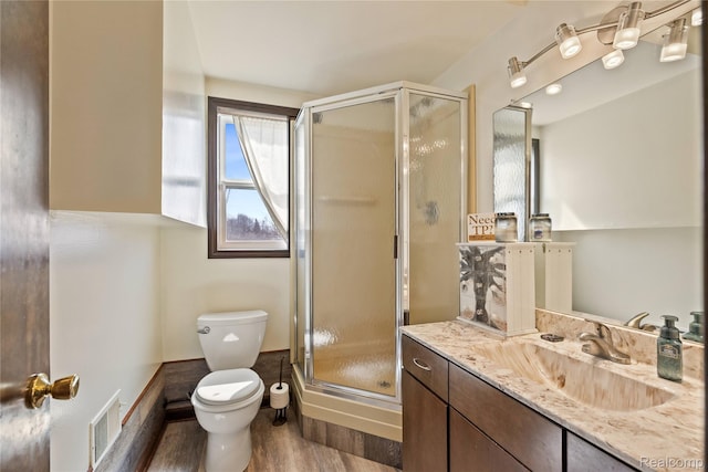 254 Cross Timbers St, Oxford, MI 48371 - full bath featuring vanity, a shower stall, and wood finished floors