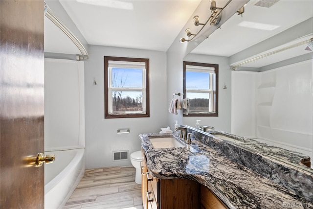 254 Cross Timbers St, Oxford, MI 48371 - full bath with vanity, wood finished floors, and shower / bathtub combination