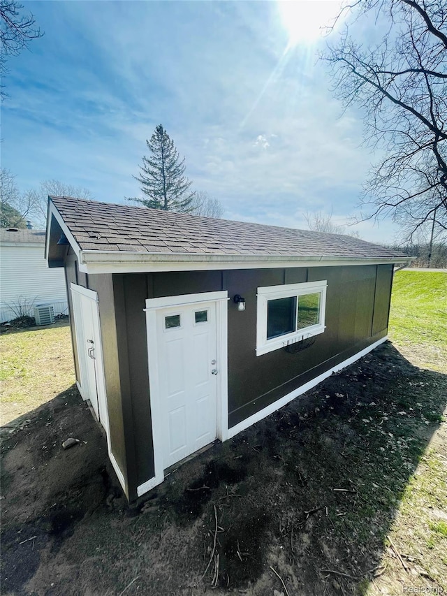 10365 Alans Dr, Fowlerville, MI 48836 - view of outdoor structure featuring central AC unit