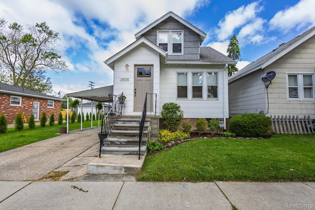 17173 New York St, Detroit, MI 48224 - view of front of house featuring driveway and a carport