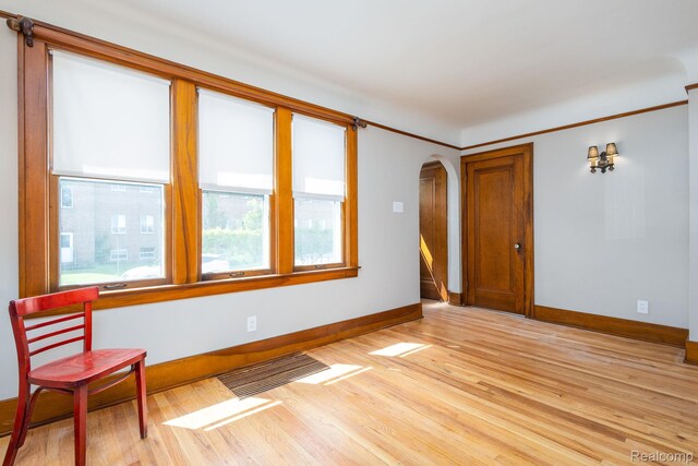 17173 New York St, Detroit, MI 48224 - unfurnished room with arched walkways, healthy amount of natural light, and baseboards