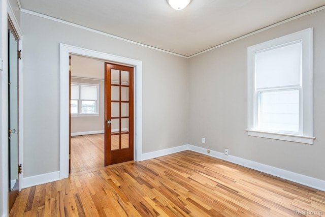 17173 New York St, Detroit, MI 48224 - empty room with french doors, ornamental molding, light wood-style floors, and baseboards