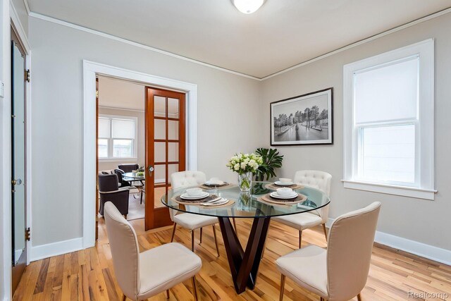 17173 New York St, Detroit, MI 48224 - dining space with ornamental molding, light wood-style floors, french doors, and baseboards