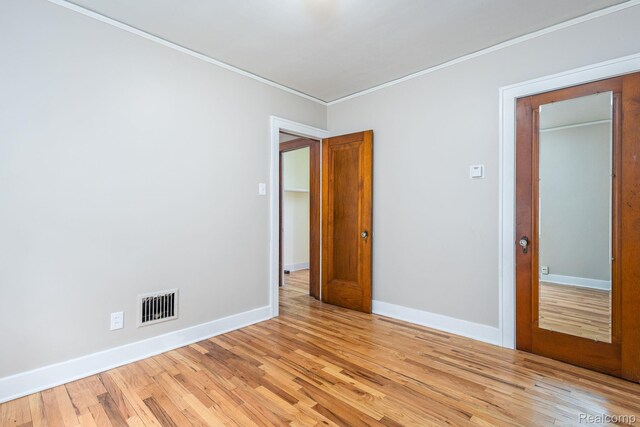 17173 New York St, Detroit, MI 48224 - empty room featuring ornamental molding, light wood finished floors, and baseboards