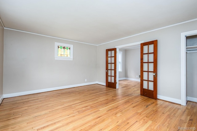 17173 New York St, Detroit, MI 48224 - unfurnished room featuring french doors, light wood-style flooring, crown molding, and baseboards