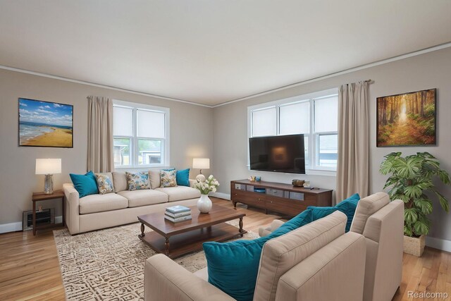 17173 New York St, Detroit, MI 48224 - living area with crown molding, baseboards, and light wood-style floors