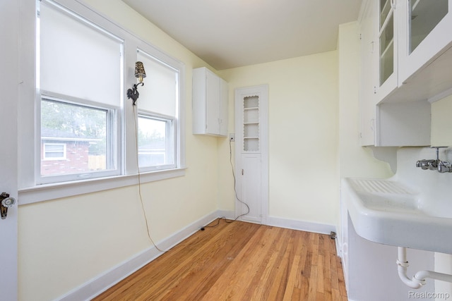 17173 New York St, Detroit, MI 48224 - laundry room featuring baseboards and light wood-type flooring
