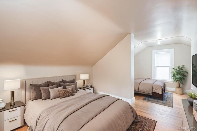 17173 New York St, Detroit, MI 48224 - bedroom featuring light wood-type flooring and lofted ceiling
