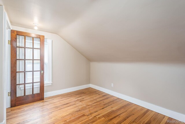 17173 New York St, Detroit, MI 48224 - additional living space featuring baseboards, wood finished floors, and lofted ceiling