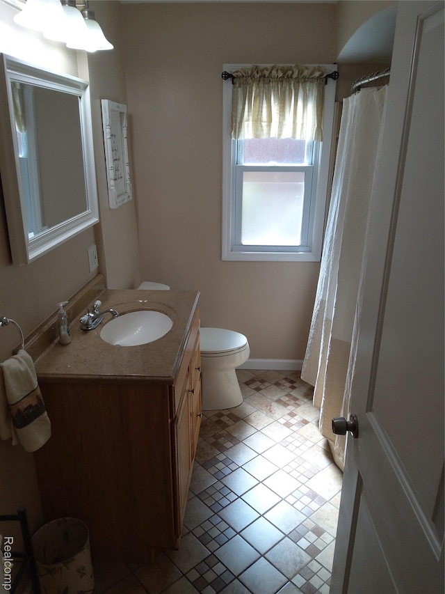 24934 Wilson Ave S, Dearborn, MI 48128 - full bath featuring vanity, toilet, tile patterned flooring, and curtained shower