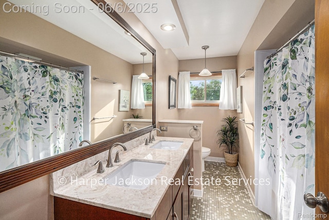 2210 Brookhaven Dr, Flint, MI 48507 - bathroom featuring toilet, double vanity, baseboards, tile patterned floors, and a shower with shower curtain