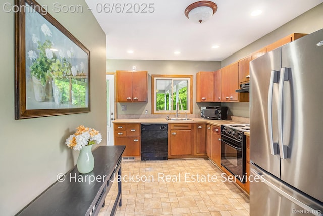 2210 Brookhaven Dr, Flint, MI 48507 - kitchen featuring black appliances, under cabinet range hood, light countertops, brown cabinets, and a sink