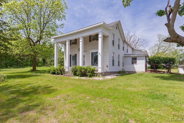 4460 Munger Rd, Tipton, MI 49287 - view of front facade with a front yard and a porch