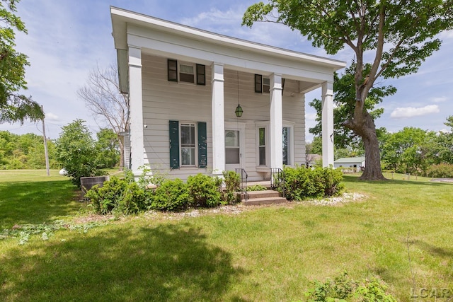 4460 Munger Rd, Tipton, MI 49287 - greek revival inspired property featuring a front lawn and covered porch