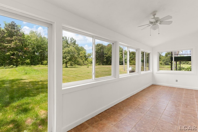 4460 Munger Rd, Tipton, MI 49287 - unfurnished sunroom featuring healthy amount of natural light, tile patterned floors, baseboards, and lofted ceiling